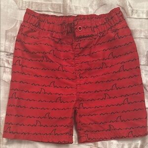 Red Swim Trunks with Stylish Script Pattern